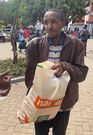 Chrsipus Nguyo holding his shopping