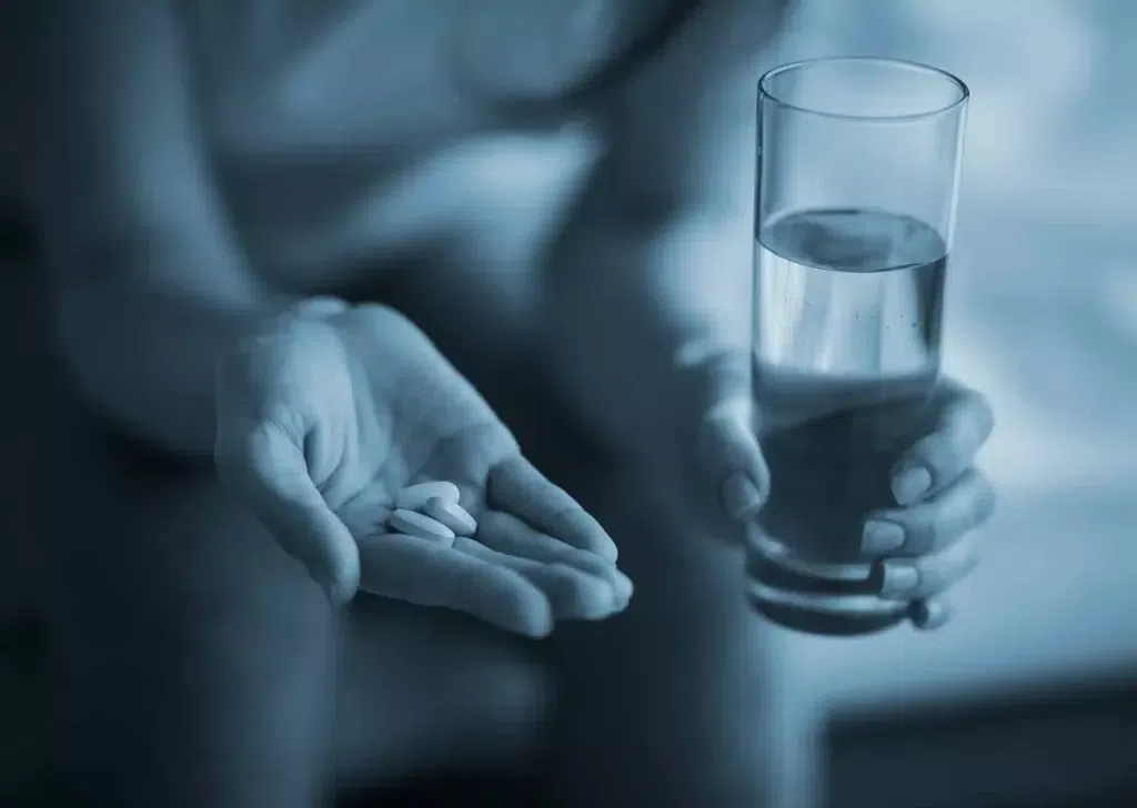 A person taking medication