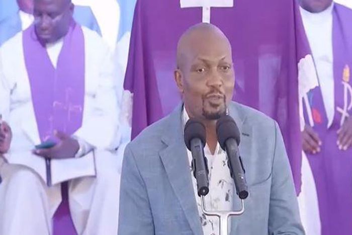 CS Moses Kuria speaking during the funeral service of Jimmy Wanjigi's father