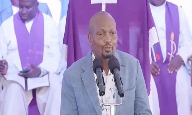 CS Moses Kuria speaking during the funeral service of Jimmy Wanjigi's father