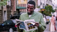 A photo of a man reading a booklet. Photo credits: Pixabay