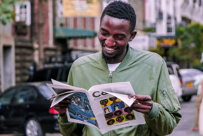 A photo of a man reading a booklet. Photo credits: Pixabay