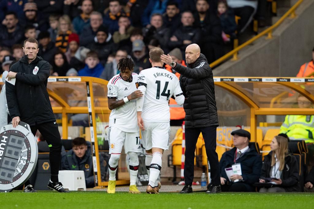 Manchester United Manager Erik ten Hag hugs midfielder Christian Eriksen (14) after substitution during the Premier League match between Wolverhampton Wanderers and Manchester United on December 31, 2022.
