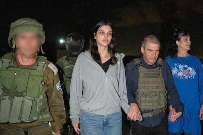 In this photo provided by the Government of Israel, Judith Raanan, right, and her 17-year-old daughter Natalie are escorted by Israeli soldiers and Gal Hirsch, Prime Minister Benjamin Netanyahu's special coordinator for returning the hostages, as they ...