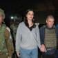 In this photo provided by the Government of Israel, Judith Raanan, right, and her 17-year-old daughter Natalie are escorted by Israeli soldiers and Gal Hirsch, Prime Minister Benjamin Netanyahu's special coordinator for returning the hostages, as they ...