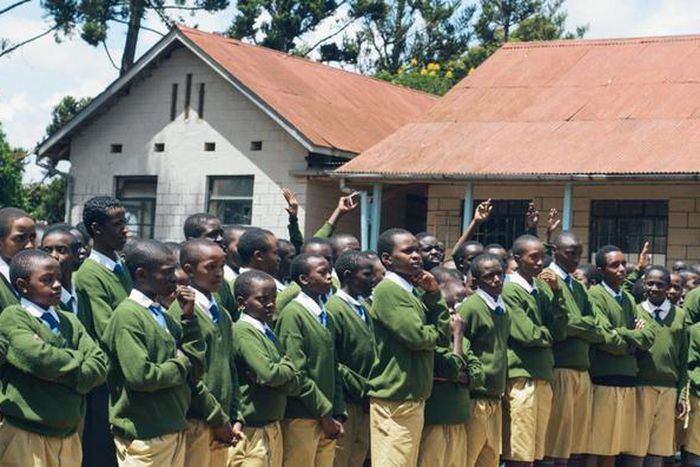 A photo of a teacher addressing Alliance High School students
