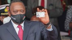 President Uhuru Kenyatta showing his Huduma Namba card after receiving it in December 2020