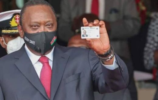 President Uhuru Kenyatta showing his Huduma Namba card after receiving it in December 2020