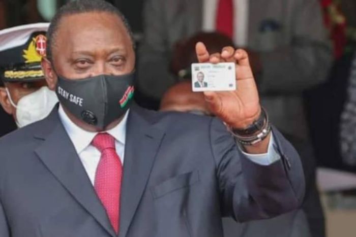 President Uhuru Kenyatta showing his Huduma Namba card after receiving it in December 2020