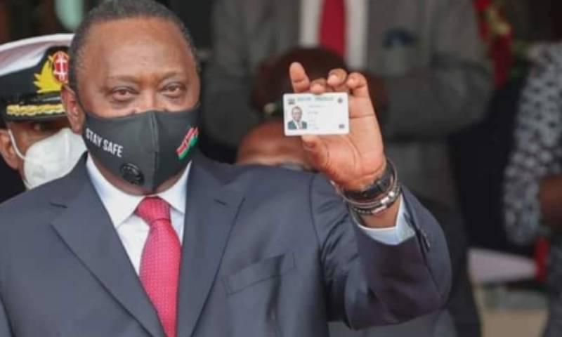 President Uhuru Kenyatta showing his Huduma Namba card after receiving it in December 2020