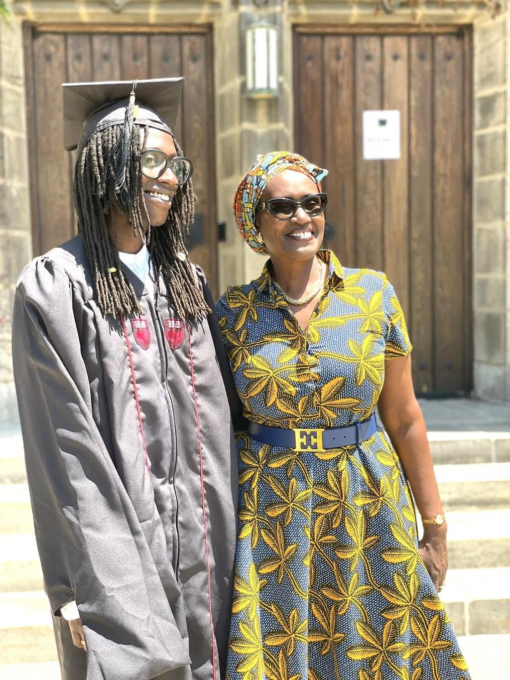 Besigye's son Anselm posing with his mother after his graduation in Chicago