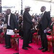 Collage image of former Prime Minister Raila Odinga exchanging greetings with Deputy President Rigathi Gachagua and President William Ruto during the funeral service of the late Mukami Kimathi