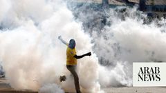 A protestor being tear gased