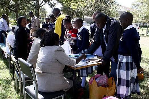 Form One students reporting for admission to secondary school