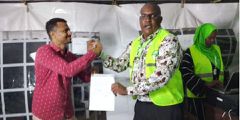 Atwaa Salim Mohamed of ODM receives certificate from Lamu West IEBC Returning Officer Isaiah Saha Madzungu
