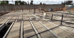 The platform created by the interlocked blocks provides a foundation for the next process of construction.