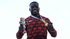 Gold medallist Kenya's Ferdinand Omanyala celebrates during the medal ceremony for the men's 100m athletics event at the Alexander Stadium, in Birmingham on day seven of the Commonwealth Games in Birmingham, central England, on August 4, 2022. (Photo b...