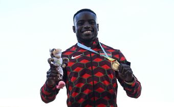 Gold medallist Kenya's Ferdinand Omanyala celebrates during the medal ceremony for the men's 100m athletics event at the Alexander Stadium, in Birmingham on day seven of the Commonwealth Games in Birmingham, central England, on August 4, 2022. (Photo b...