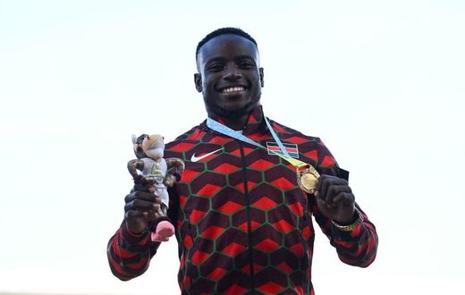 Gold medallist Kenya's Ferdinand Omanyala celebrates during the medal ceremony for the men's 100m athletics event at the Alexander Stadium, in Birmingham on day seven of the Commonwealth Games in Birmingham, central England, on August 4, 2022. (Photo b...