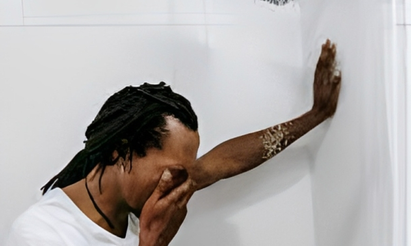 Man crying in the bathroom