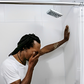 Man crying in the bathroom