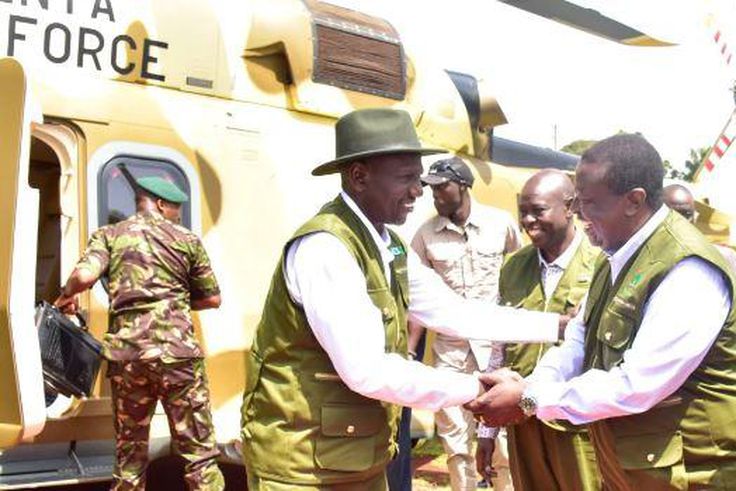 President William Ruto shaking hands with Prime CS Musalia Mudavadi as DP Rigathi Gachagua watches in Kaptagat Forest in Elgeyo Marakwet County on July 1, 2023