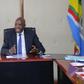 Ezekiel Machogu chairs a meeting in his office
