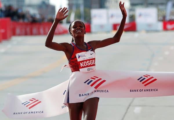 Brigid Kosgei crossing the finishing line of Chicago Marathon. (The New York Times)