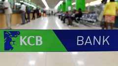 Customers are served at the Kenya Commercial Bank (KCB) in Nairobi on January 24, 2018. (Photo by SIMON MAINA/AFP via Getty Images)