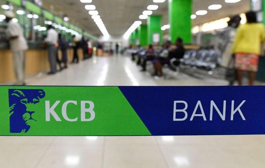 Customers are served at the Kenya Commercial Bank (KCB) in Nairobi on January 24, 2018. (Photo by SIMON MAINA/AFP via Getty Images)