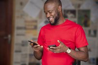 A man using two phones