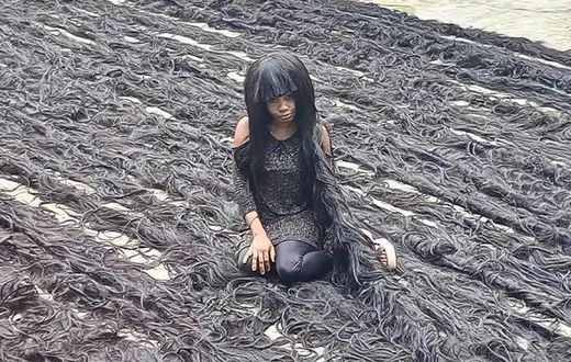 Nigerian lady sets new Guinness World Record for longest handmade wig [TheStar]
