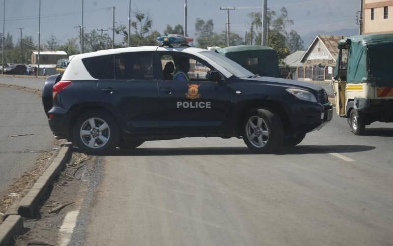 A file photo of a police car on the road