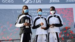 The 2021 Ostia Half Marathon women's race podium finishers Joyce Chepkemoi Tele, Betty Chepkemoi Kibet and Gloria Kite during the award ceremony