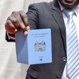 A man holding a Kenyan passport