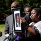 Caroline Ouko, mother of Irvo Otieno, holds a portrait of her son at a news conference in March. Photo Credit: Daniel Sangjib Min/Richmond Times-Dispatch, via Associated Press