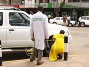 Nairobi County parking attendants interact with motorists