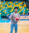 Israel Mbonyi testing his basketball skills following a UGC Basketball Club match at the Kigali Arena