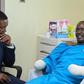 Tourism CS Alfred Mutua at Nairobi West hospital when he visited police officer David Karuri Maina who lost both arms after a teargas canister exploded during the anti-finance bill protests