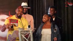 Twitter Influencer of the Year Boniface Mwangi hands over title to Esther Kazungu during the 2021 Pulse Influencer Awards ceremony