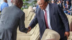 President William Ruto shaking hands with his predecessor, retired President Uhuru Kenyatta in Kinshasa