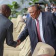 President William Ruto shaking hands with his predecessor, retired President Uhuru Kenyatta in Kinshasa