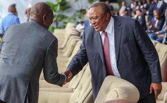 President William Ruto shaking hands with his predecessor, retired President Uhuru Kenyatta in Kinshasa