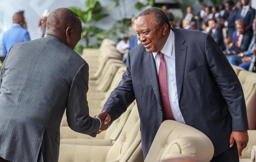 President William Ruto shaking hands with his predecessor, retired President Uhuru Kenyatta in Kinshasa