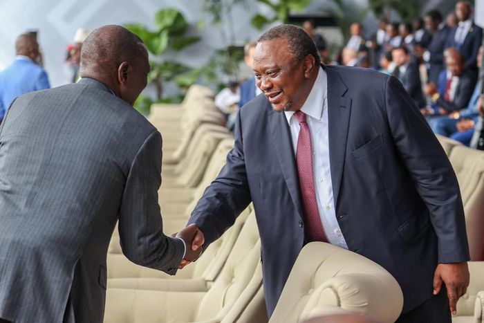 President William Ruto shaking hands with his predecessor, retired President Uhuru Kenyatta in Kinshasa