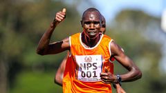 National Police Service Geoffrey Kamworor celebrates his lead ahead of Daniel Simiu in 10km senior men on January 6, 2023 during the National Police Service National Cross Country Championship, at Ngong race Course, Nairobi. Photo/CHRIS OMOLLO Copyrigh...