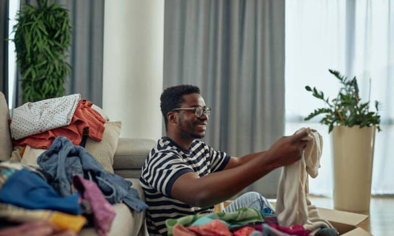 A man folding clothes