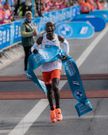 Eliud Kipchoge celebrates after winning the Berlin Marathon