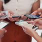 A photo of people using their phones
