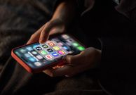 iPhone screen showing various social media apps including TikTok, Facebook and X.Matt Cardy